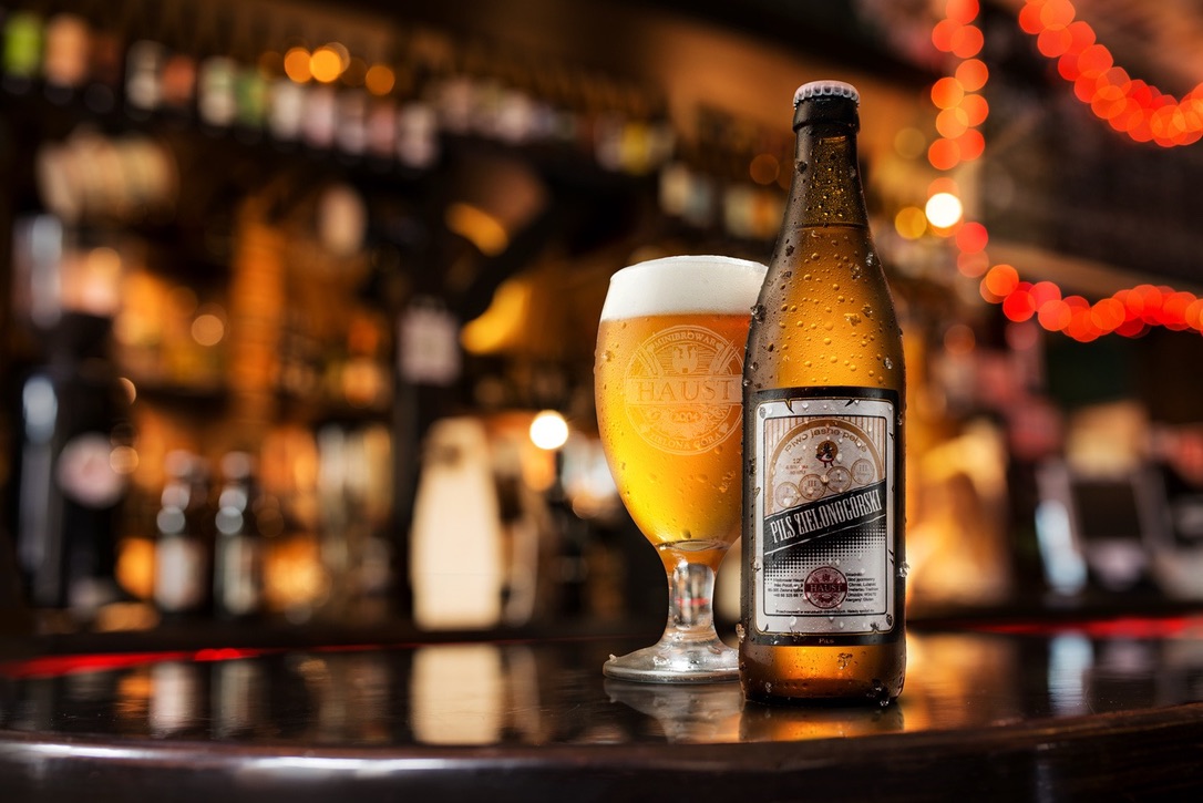 Haust Pils bottle and glass on bar counter